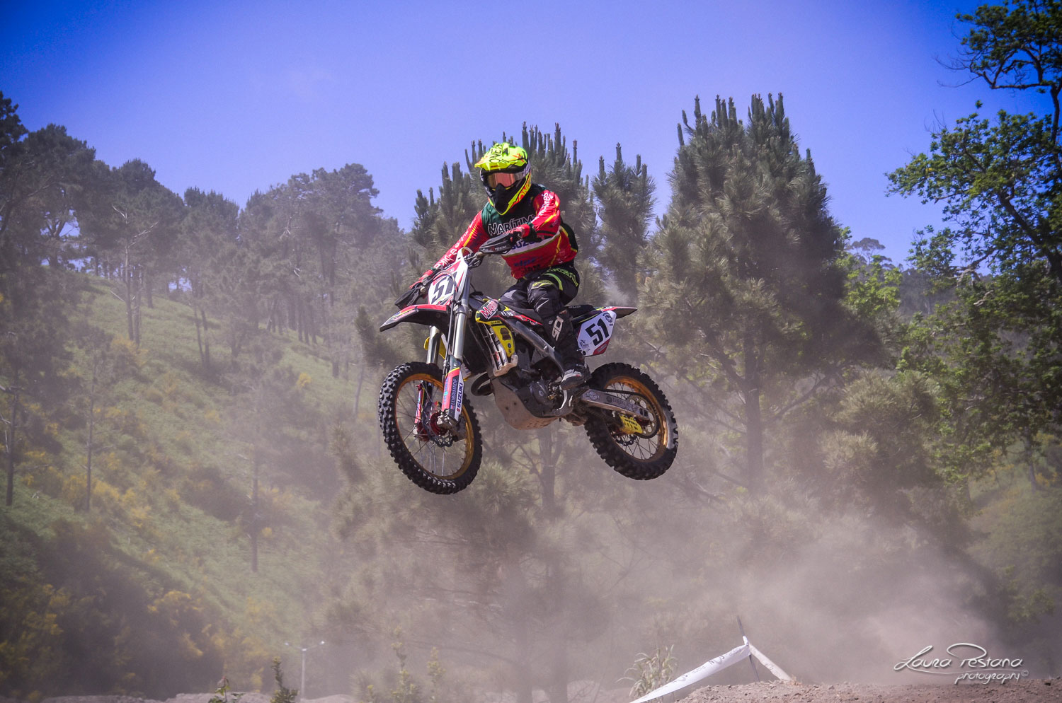 A rider jumping a double on his Suzuki RMZ 450